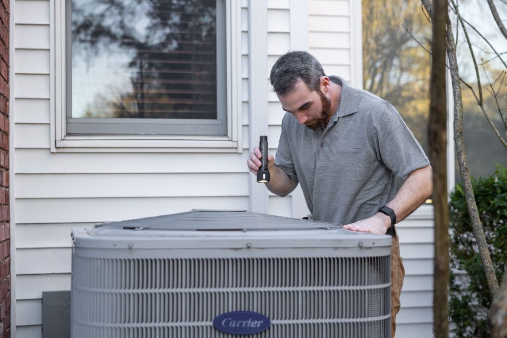 Man checking HVAC system